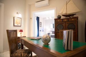 a dining room with a table with a clock on it at Authentic Sweet Home in Rome