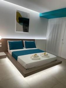 Voodi või voodid majutusasutuse Il Faraglione - Suite di Charme toas