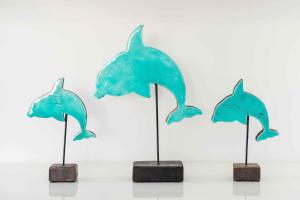a group of three dolphin umbrellas on posts at I Tre Delfini apartment in center-Sorrento Coast in Vico Equense