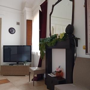 A television and/or entertainment centre at Happy Holiday