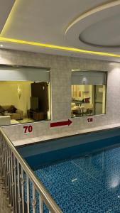 a view of a swimming pool in a building at ازورايت الردف لبيوت العطلات in Taif +4 photos