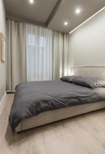 En eller flere senge i et værelse på Luxury Apartment Kościuszki 9 - Apartament Vellore