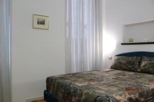 Postel nebo postele na pokoji v ubytování Casa Elli Serbelloni 12 + 37 fotografií