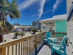 a deck with two chairs and a table at La Favorita in Navarre
