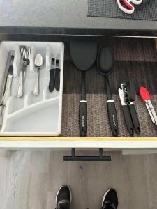 a drawer filled with utensils and utensils at Harborside Suites in Yarmouth