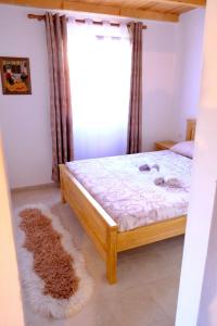 a bedroom with a bed and a window at Sunlight Cottage Maya in Virpazar +27 photos