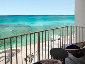 a balcony with a view of the ocean at Grand Cayman Marriott Resort in George Town +97 photos