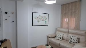 Ein Sitzbereich in der Unterkunft Apartamentos Maria Cristina con parking gratis