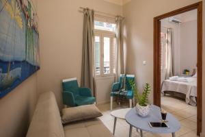 a living room filled with furniture and a window at Studios Kiara in Chania Town