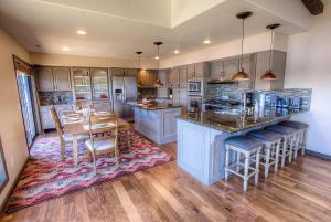 a kitchen with a table and a dining room at Epiphany home in South Lake Tahoe
