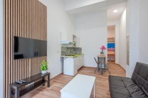 Μια τηλεόραση ή/και κέντρο ψυχαγωγίας στο J&N Apartament La Palmera 2