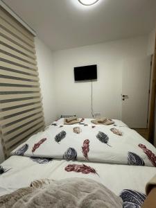 Postel nebo postele na pokoji v ubytování Ivanovic + 14 fotografií