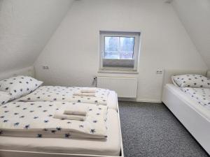 Postel nebo postele na pokoji v ubytování Bed and Breakfast Am Knittenberg