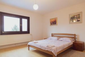 Katil atau katil-katil dalam bilik di Vacation house Green Heaven +33 gambar