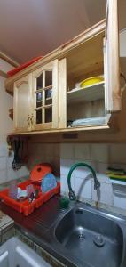 a kitchen with a sink and a counter top at Mi casa tu casa. My house in La Paz