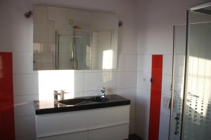 a bathroom with a sink and a mirror at Bella Vita in Postojna