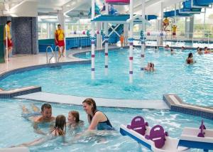 a group of people in a swimming pool at Abi static caravan close to Edinburgh in Port Seton