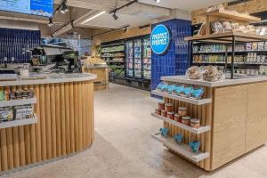 a grocery store aisle with a counter in a store at Boga Mexico City by Lumina in Mexico City