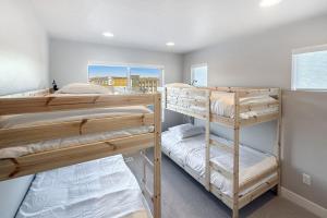 a bedroom with two bunk beds and a window at Silver Creek Sanctuary in Park City