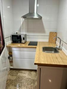 Kuchyň nebo kuchyňský kout v ubytování Escapada Perfecta en Sanxenxo - Apartamento en Portonovo con Encanto + 5 fotografií