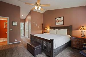 a bedroom with a bed and a ceiling fan at 164 Jillian - Private peaceful retreat in Three Rivers +13 photos