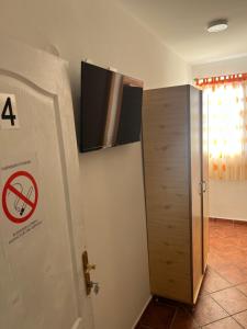 a door with a no trespassing sign on it next to a door at Nova Čubura in Šid