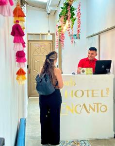 a woman standing in front of a hotel acerate at Encanto 3 in Santa Rosa de Cabal