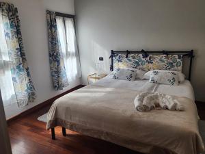 Postel nebo postele na pokoji v ubytování La Corte Guesthouse