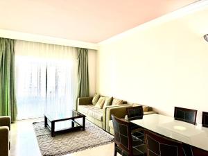 a living room with a couch and a table at Apartment in Houmt Souk