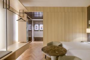 Postel nebo postele na pokoji v ubytování AC Hotel Firenze by Marriott