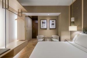 Postel nebo postele na pokoji v ubytování AC Hotel Firenze by Marriott