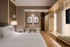 TV a/nebo společenská místnost v ubytování AC Hotel Firenze by Marriott