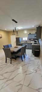 a dining room and kitchen with a table and chairs at Sofia apartment in Puerto Peñasco
