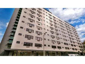 a large white building with windows on the side of it at Horizon Hideaway in Mobile