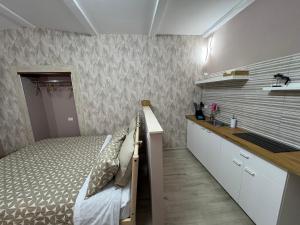a small bedroom with a bed and a sink at B&B del Gatta in San Severo