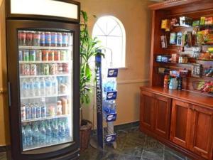 a drink cooler in a store with aperature at Folk Inn Ontario Airport in Ontario