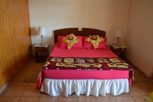Giường trong phòng chung tại Cabañas Mataveri