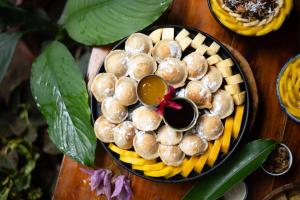 a plate of food on a wooden table at Wonderland in Siquijor