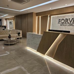 a lobby of a moxica store with a counter at MINT APARTMENT 1 HAB, Piscina, Shopping del Sol in Asuncion +10 photos