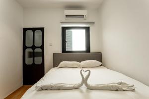 Postel nebo postele na pokoji v ubytování Earnest Hotel Georgetown