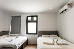 Postel nebo postele na pokoji v ubytování Earnest Hotel Georgetown