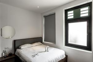 Postel nebo postele na pokoji v ubytování Earnest Hotel Georgetown