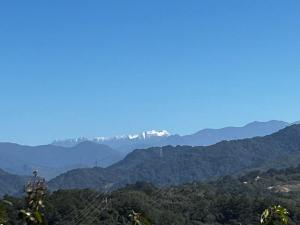 a mountain view with snow capped mountains in the distance at Miaoli Sanyi Travelling Homestay in Sanyi