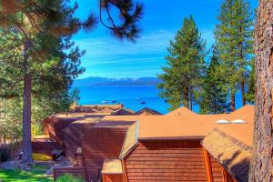 a house with a view of the water at Chipmunk's Paradise condo in Kings Beach