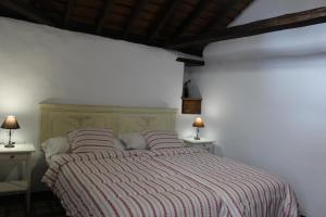 Łóżko lub łóżka w pokoju w obiekcie Casitas La Montañita