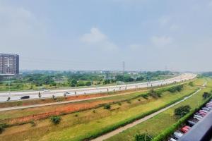 a view of a highway with cars on the road at Comfy Designed and Modern Studio at Sky House BSD Apartment By Travelio in Tangerang
