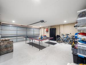 a room with a ping pong table in a garage at Busselton Broadwater Holiday Home in Busselton