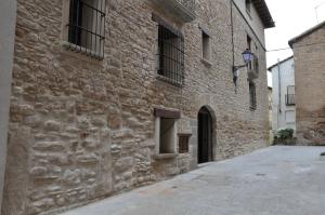 an alley in an old stone building at Apartamentos Turismo Rural Casa Purroy in El Grado