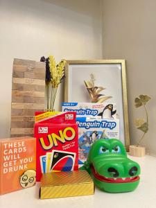 a table with toys and other items on it at Orchids Shore Residences Direct Pool Access in Manila