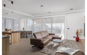 a living room with a couch and a table at Casa Fani in Poljane